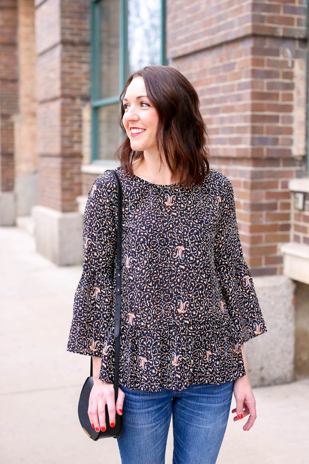 little black bag and floral peplum top