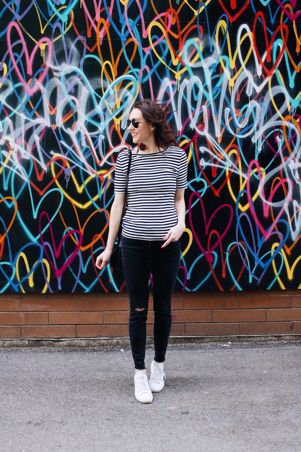 striped shirt and black skinny jeans