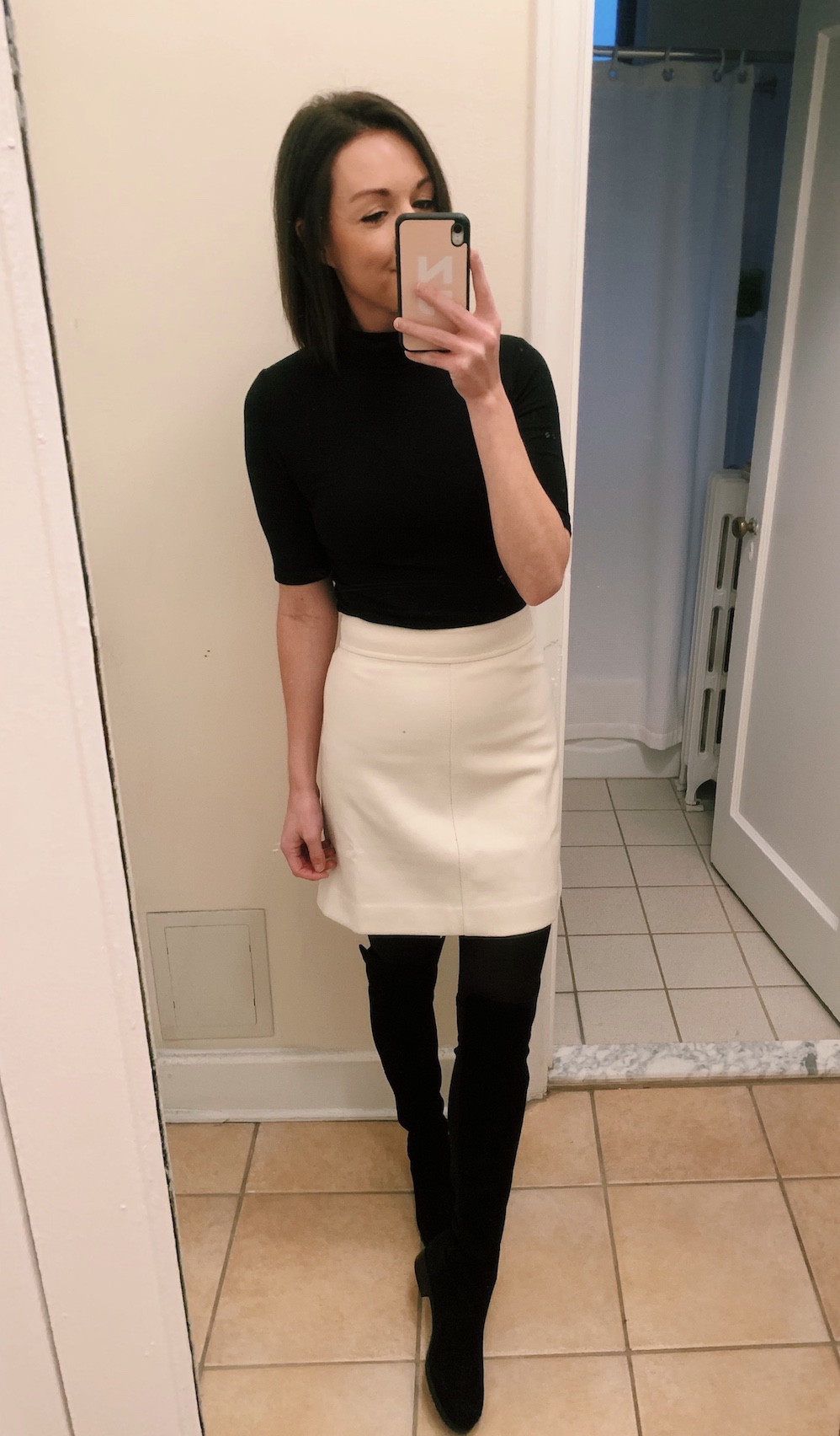 white skirt with OTK boots